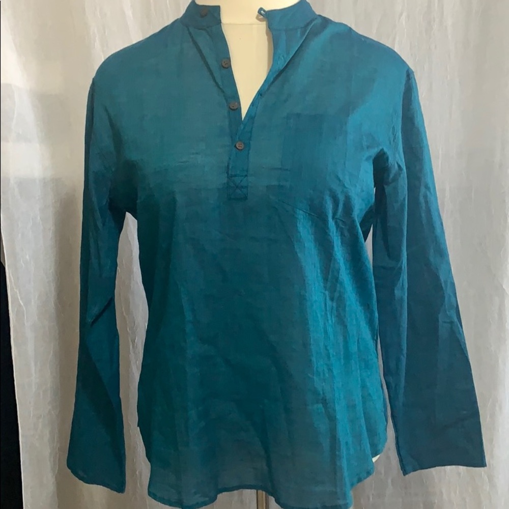 Beautiful woman’s teal color blouse size L/42